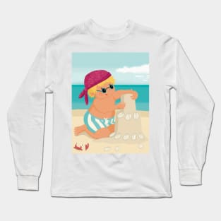 Cute little boy is on vacation building a sand castle on the beach Long Sleeve T-Shirt